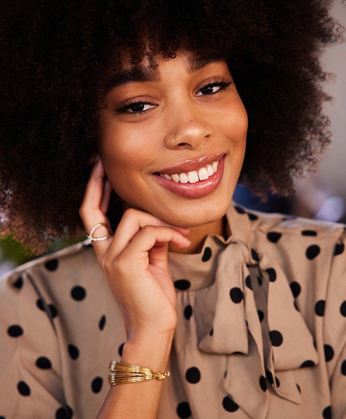 Woman relaxing by a pool, serene expression.