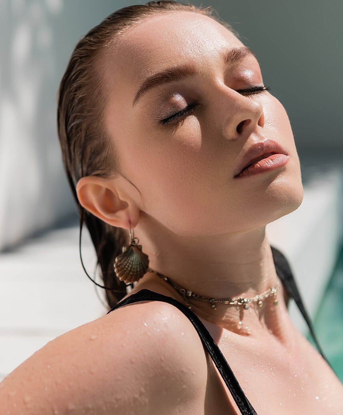 Smiling woman with long, light brown hair.