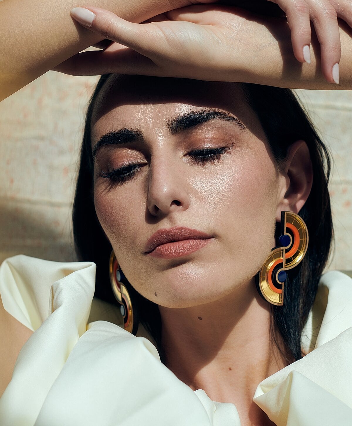 Smiling woman with long, light brown hair.